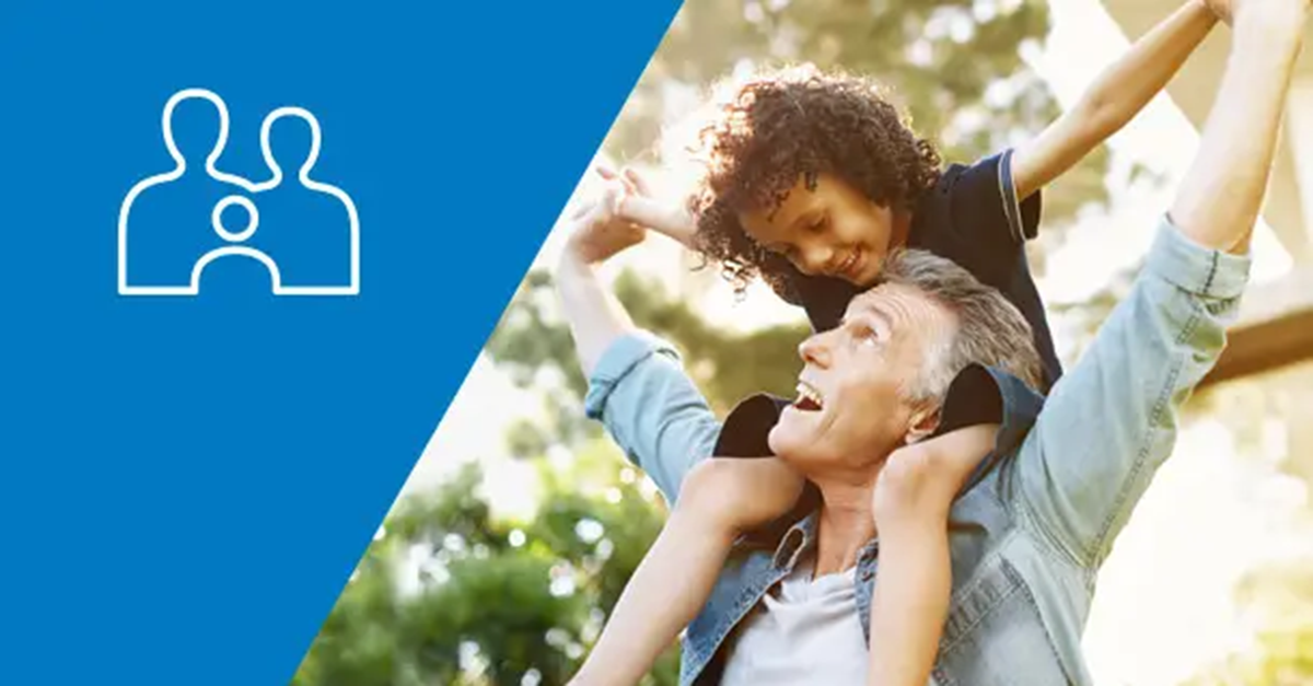 Father or grandfather with young girl on shoulders